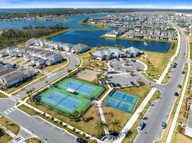 birds eye view of property featuring a residential view and a water view