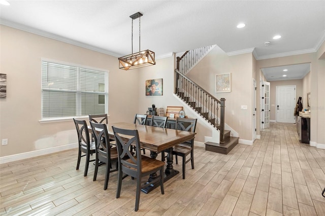 dining room featuring stairs, crown molding, baseboards, and light wood-type flooring