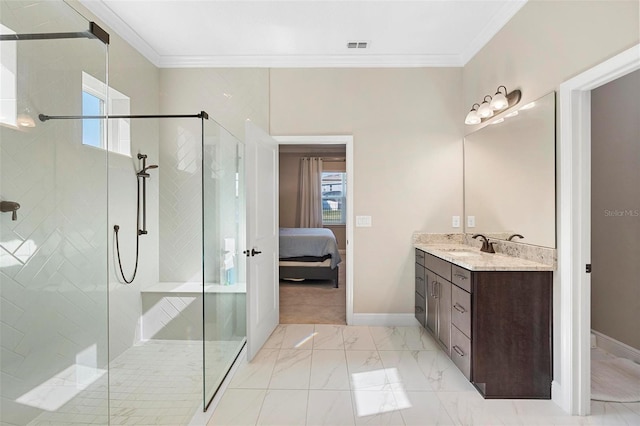 ensuite bathroom with vanity, a shower stall, ensuite bathroom, and ornamental molding