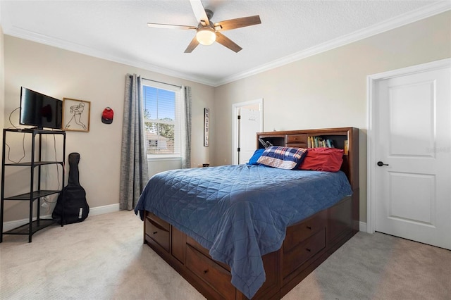 bedroom with light colored carpet, crown molding, baseboards, and ceiling fan