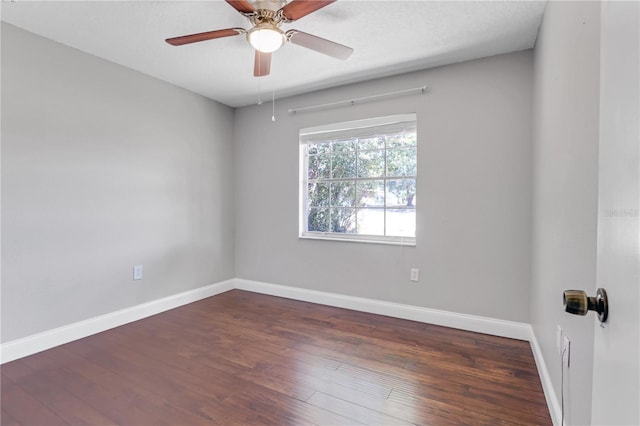 unfurnished room featuring ceiling fan, baseboards, and wood finished floors