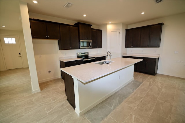 kitchen with visible vents, recessed lighting, a sink, stainless steel appliances, and light countertops