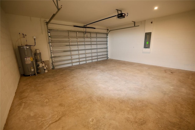 garage with electric panel, a garage door opener, and electric water heater