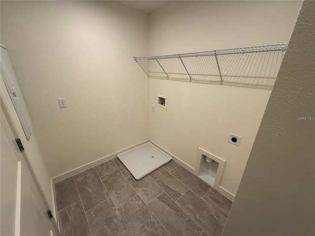 laundry room featuring laundry area, hookup for a washing machine, baseboards, and electric dryer hookup