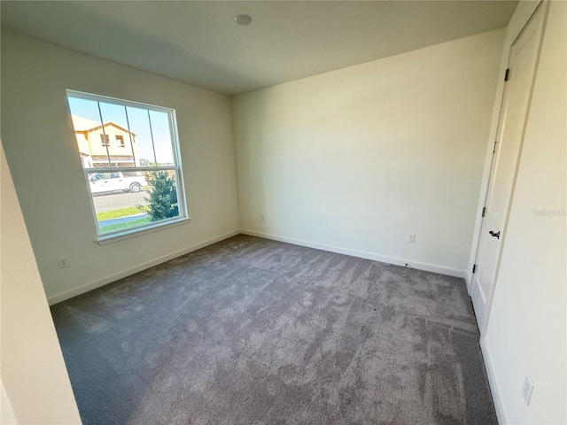 unfurnished bedroom with baseboards and carpet floors