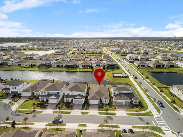 aerial view featuring a residential view and a water view