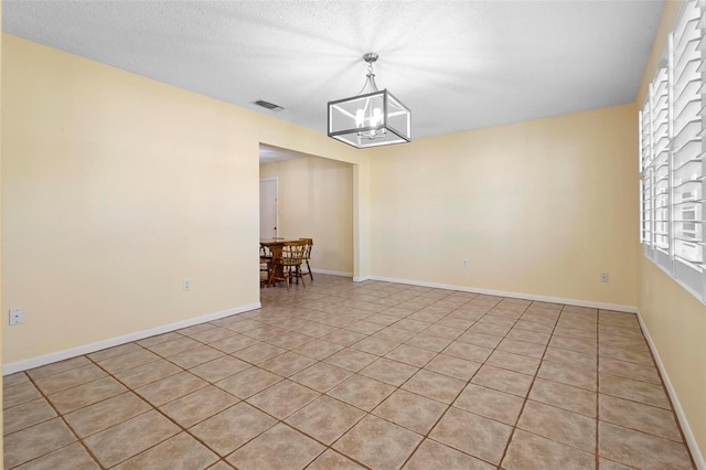 333 Crystal Cir, Oviedo, FL 32765 - spare room featuring a chandelier, light tile patterned floors, and plenty of natural light