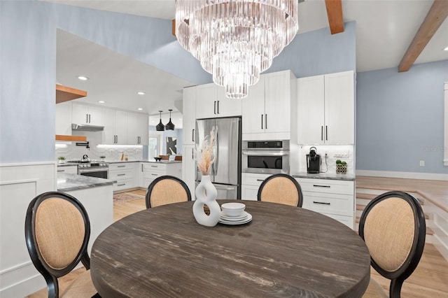 dining room with baseboards, beam ceiling, recessed lighting, light wood-style floors, and a notable chandelier