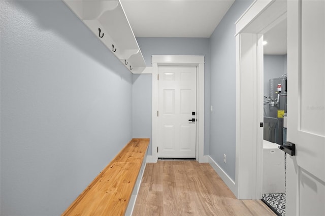 mudroom featuring light wood-type flooring and baseboards