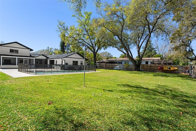 view of yard featuring a patio area, a fenced backyard, and a fenced in pool