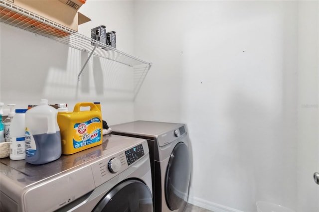 washroom with washer and dryer and laundry area