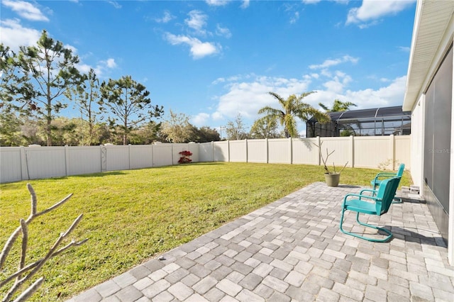 view of yard with a patio and a fenced backyard