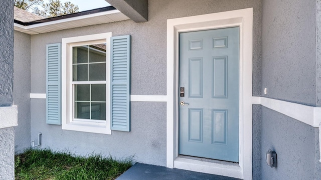 5963 Virtudes St, Sebring, FL 33872 - doorway to property featuring stucco siding