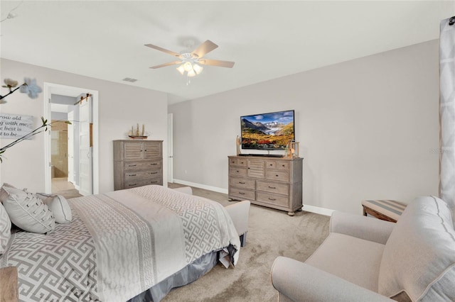 carpeted bedroom featuring baseboards and a ceiling fan