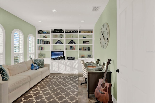 office featuring recessed lighting and visible vents