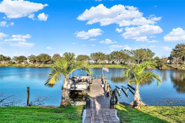 view of dock with boat lift and a water view