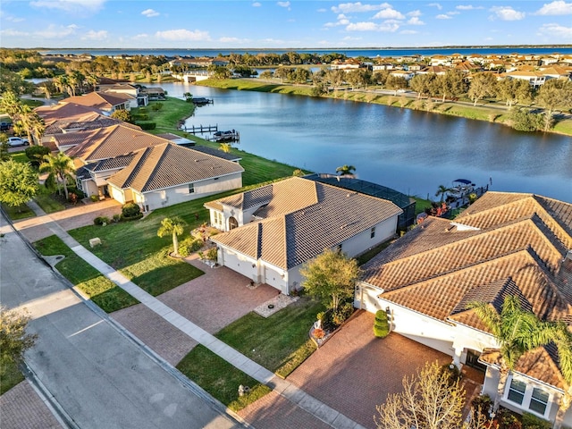 bird's eye view with a residential view and a water view