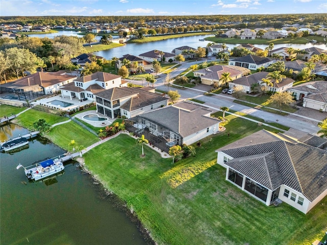 birds eye view of property featuring a residential view and a water view