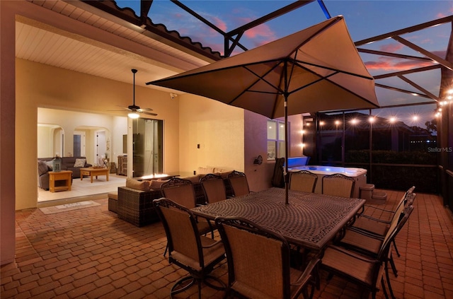 view of patio featuring outdoor lounge area, a lanai, outdoor dining space, and a ceiling fan