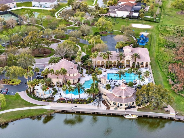 birds eye view of property with a water view and a residential view