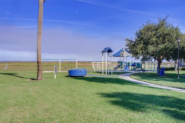 community playground featuring a lawn