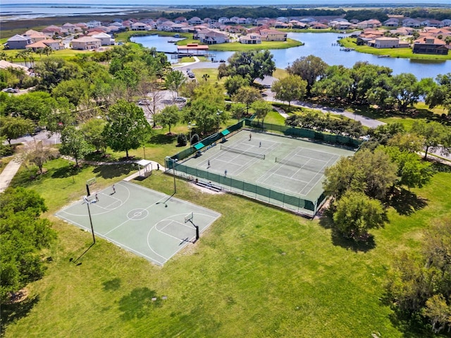 birds eye view of property featuring a residential view and a water view