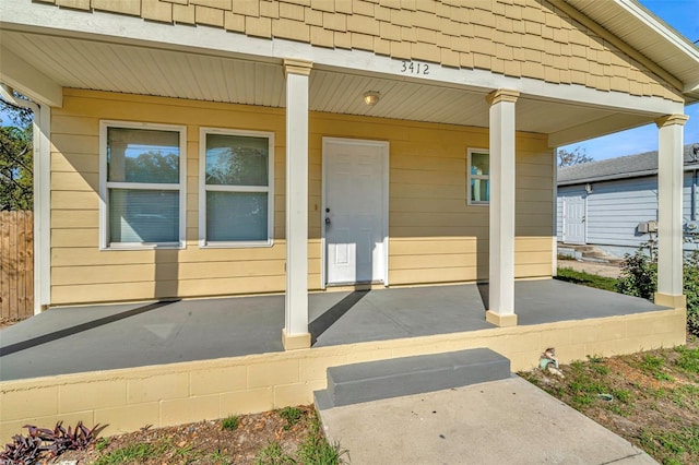 doorway to property with covered porch