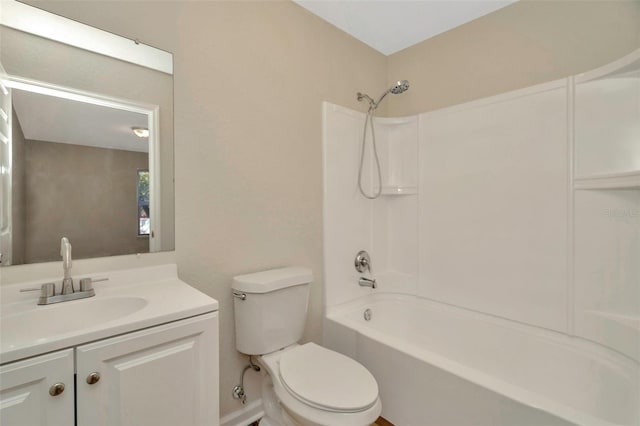 full bath featuring toilet, bathtub / shower combination, and vanity