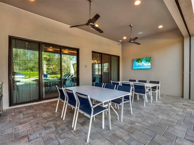 view of patio with outdoor dining space and ceiling fan