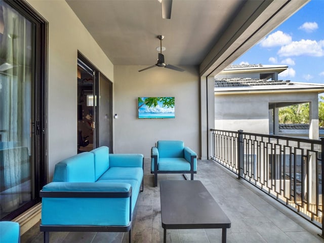 balcony with outdoor lounge area and ceiling fan