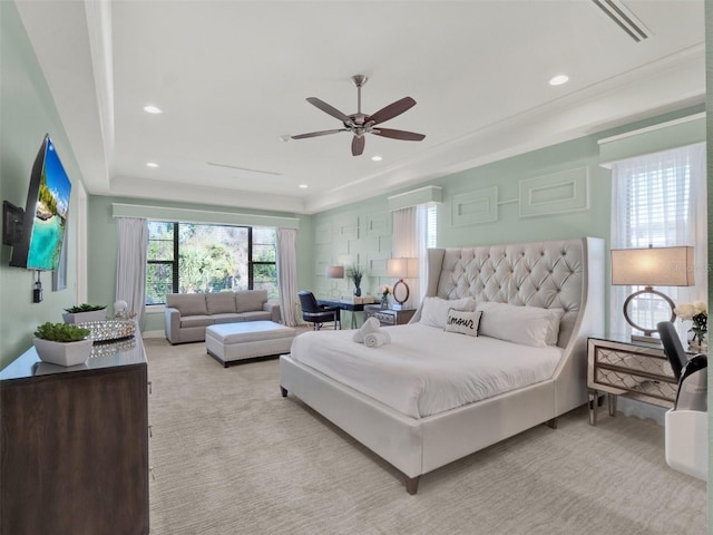 carpeted bedroom featuring a raised ceiling, recessed lighting, and ceiling fan