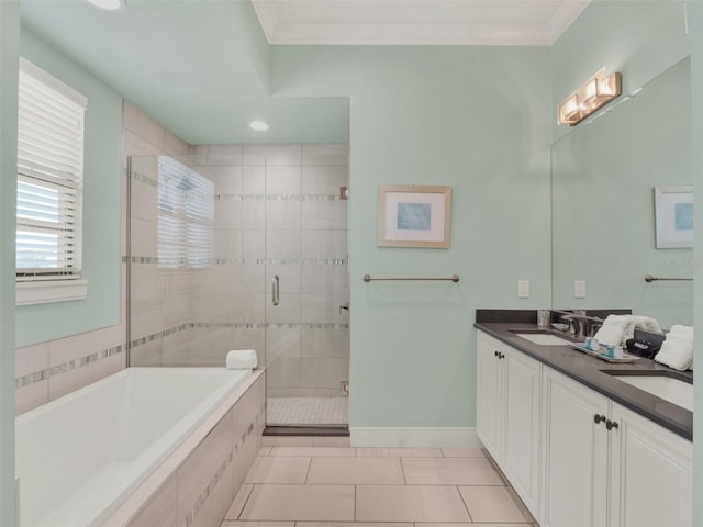 full bathroom featuring ornamental molding, a stall shower, a garden tub, and a sink