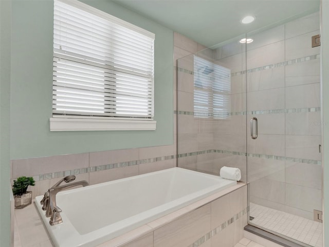 bathroom with a bath, recessed lighting, and a shower stall