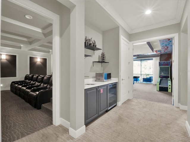 bar featuring crown molding, baseboards, beverage cooler, light carpet, and coffered ceiling