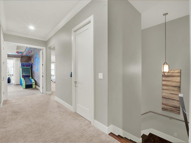 hallway with carpet flooring, recessed lighting, baseboards, and ornamental molding