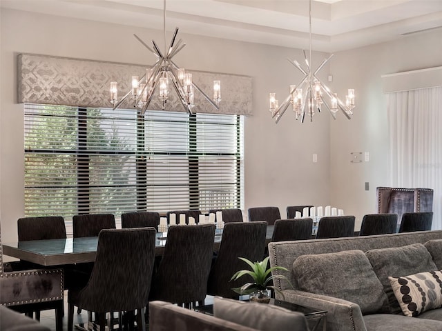 dining space featuring an inviting chandelier