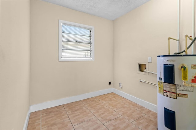 clothes washing area with baseboards, laundry area, water heater, washer hookup, and a textured ceiling