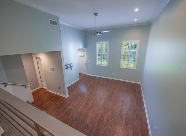 interior space featuring wood finished floors, baseboards, visible vents, recessed lighting, and ornamental molding