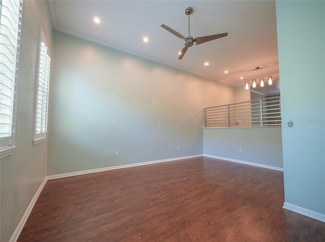 unfurnished room with a ceiling fan, wood finished floors, baseboards, and ornamental molding