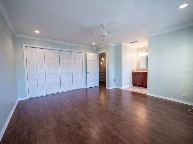 unfurnished bedroom with recessed lighting, crown molding, baseboards, and wood finished floors