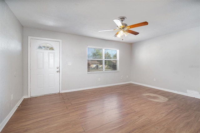 entrance foyer featuring baseboards, wood finished floors, and ceiling fan