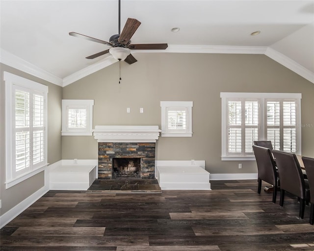 living room with lofted ceiling, wood finished floors, a fireplace, and ornamental molding