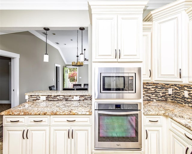 kitchen featuring ornamental molding, decorative light fixtures, stainless steel appliances, decorative backsplash, and lofted ceiling