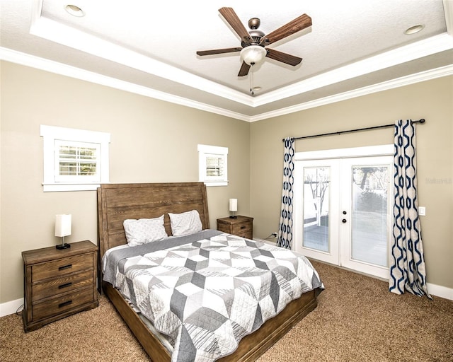 bedroom with french doors, a raised ceiling, ornamental molding, and access to outside