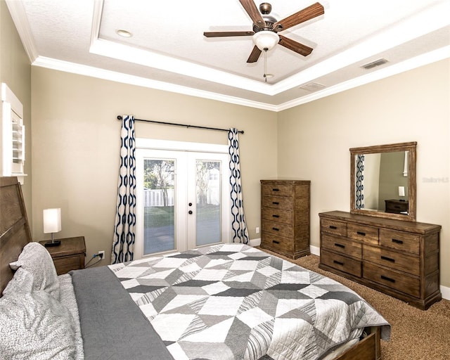 carpeted bedroom with access to exterior, visible vents, crown molding, and a raised ceiling