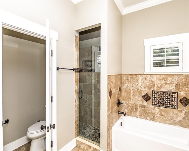 full bathroom featuring a shower stall, baseboards, toilet, a garden tub, and ornamental molding