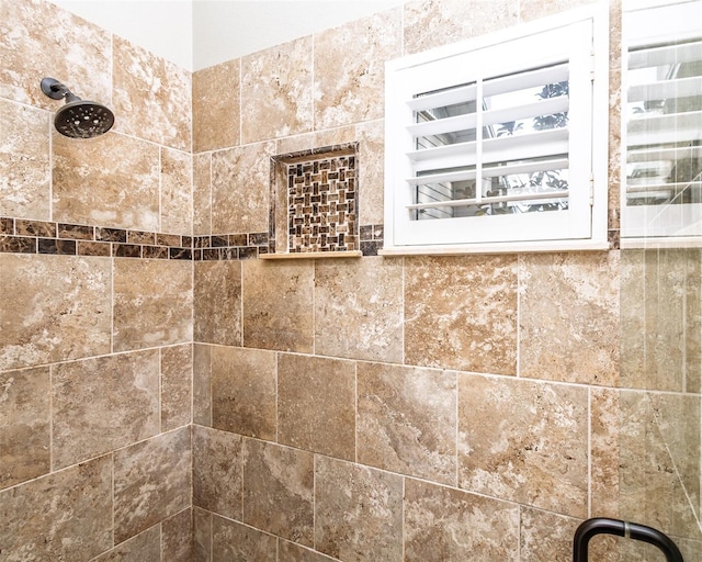 details featuring a tile shower