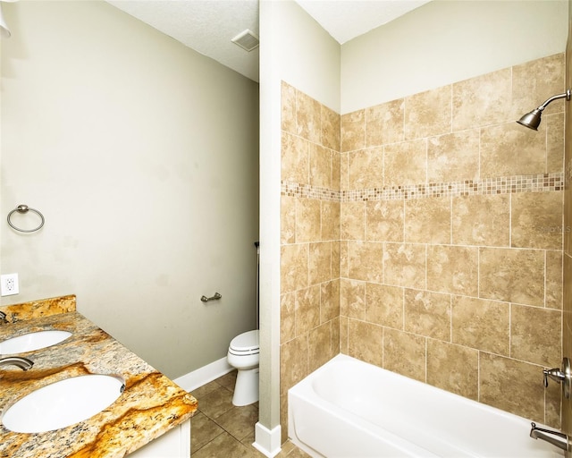 bathroom featuring a sink, visible vents, toilet, and tile patterned flooring