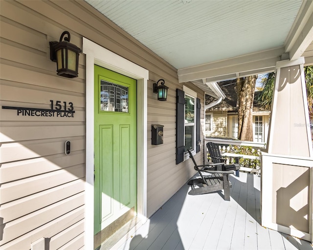 wooden terrace with a porch