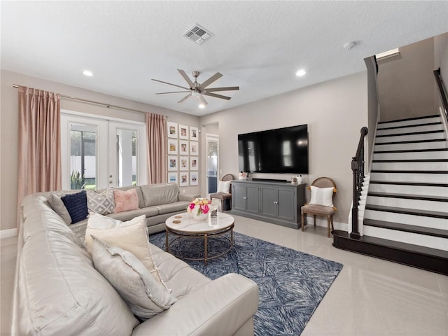 living area featuring visible vents, ceiling fan, stairway, recessed lighting, and french doors